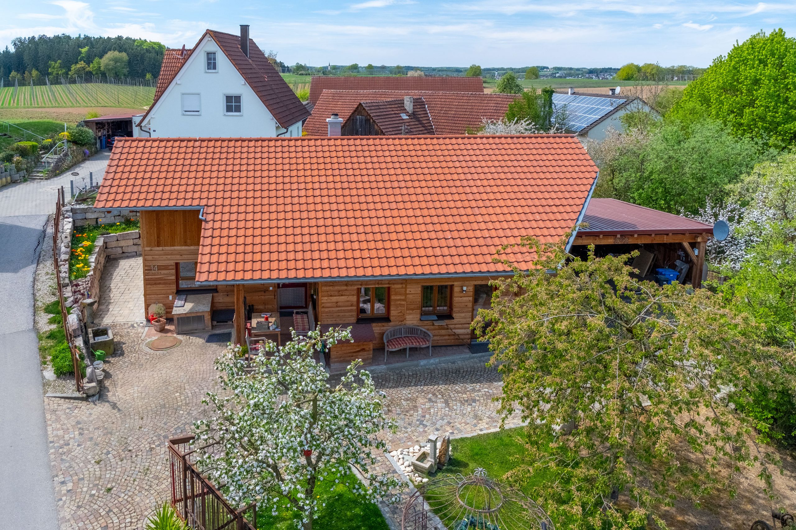 BV Wiesenberger – Einfamilienhaus Holzhaus mit überdachter Terrasse BV Wiesenberger – Einfamilienhaus Holzhaus mit überdachter Terrasse